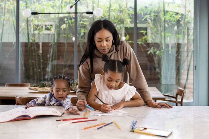 Mother homeschooling kids during the pandemic